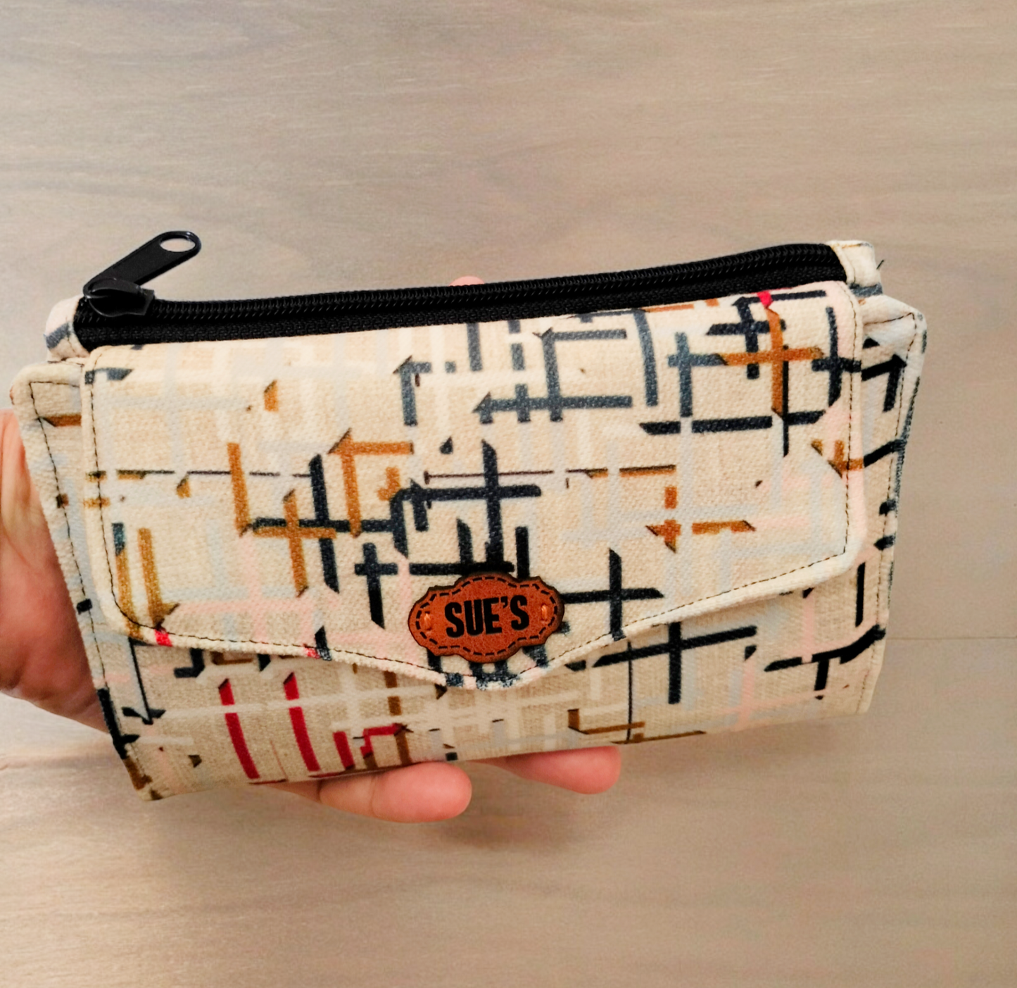 Abstract beige trifold wallet