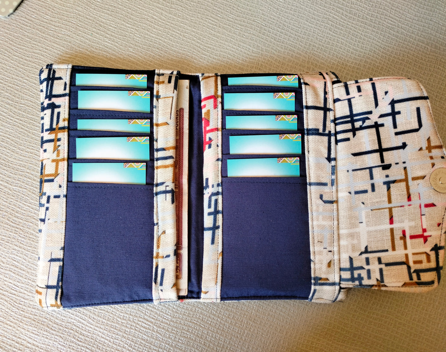 Abstract beige trifold wallet