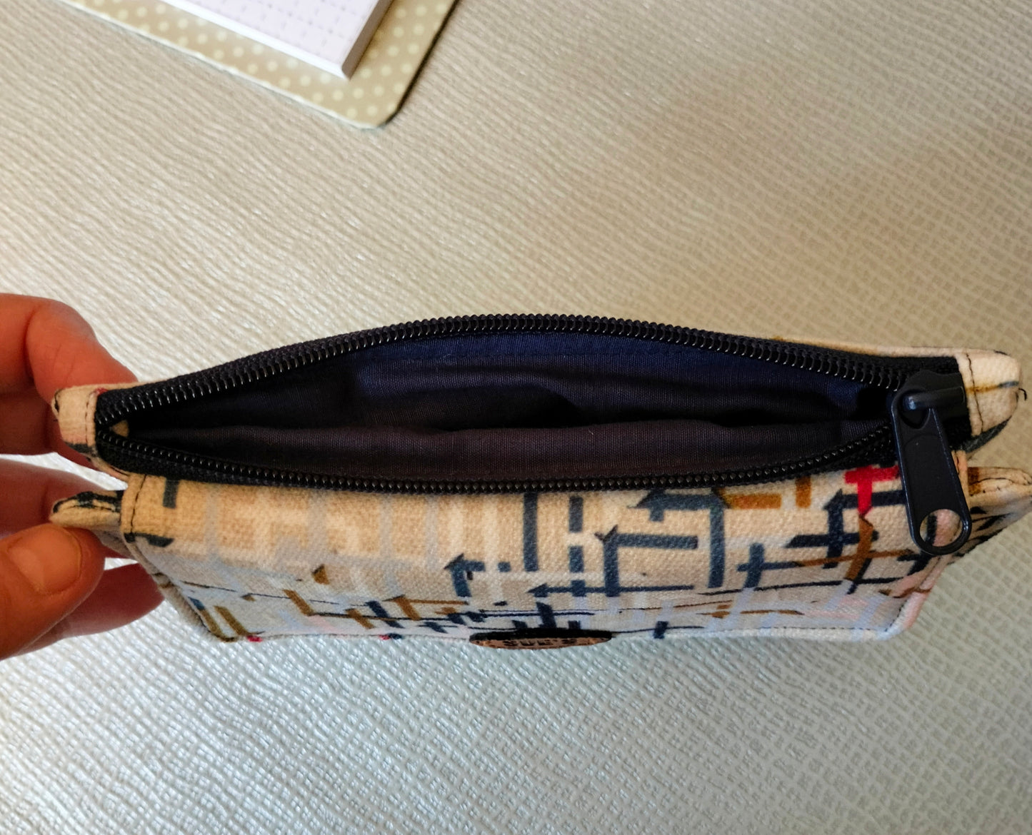 Abstract beige trifold wallet