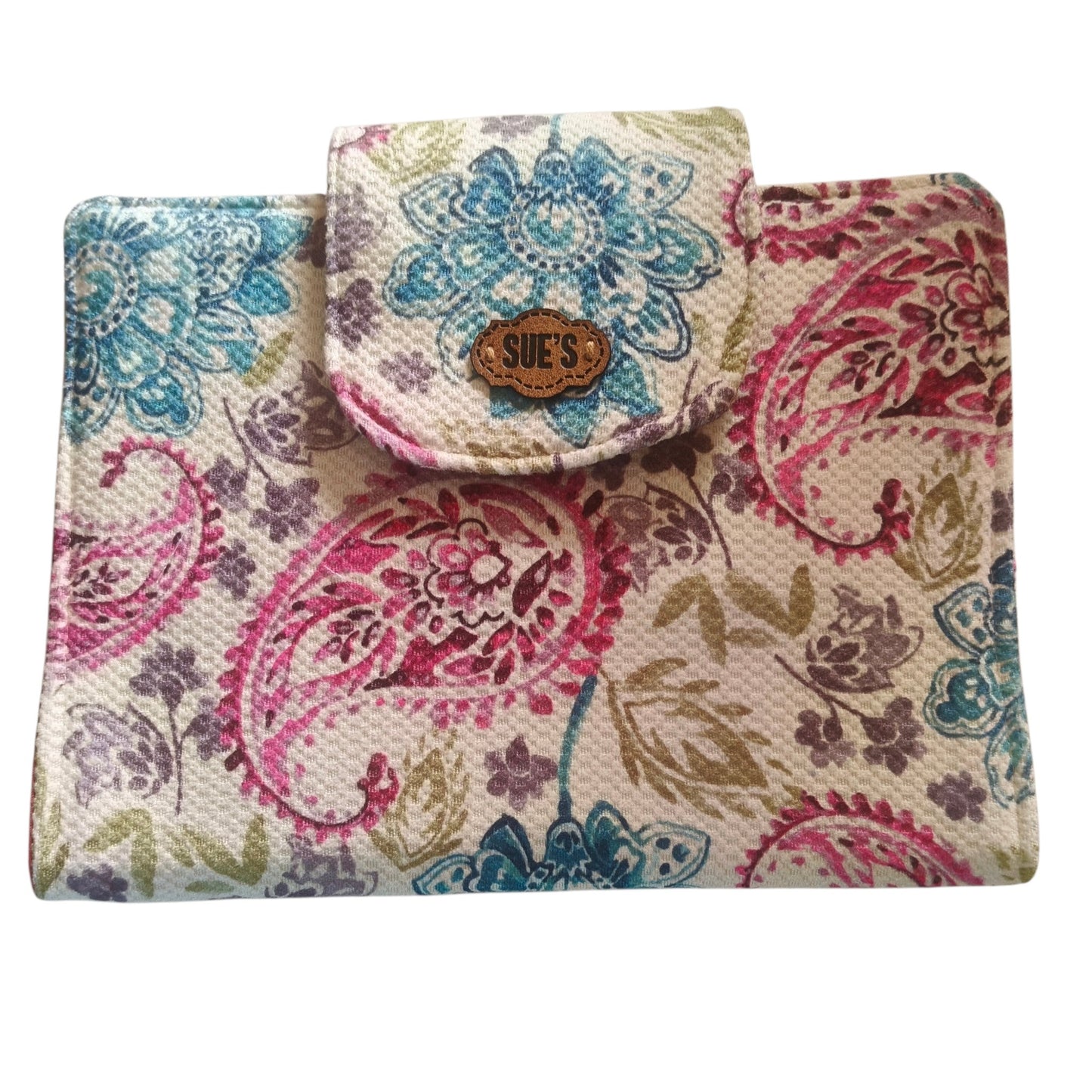 Suepatchwork handmade fabric Mushaf cover with a colourful floral paisley pattern and a branded leather button closure.