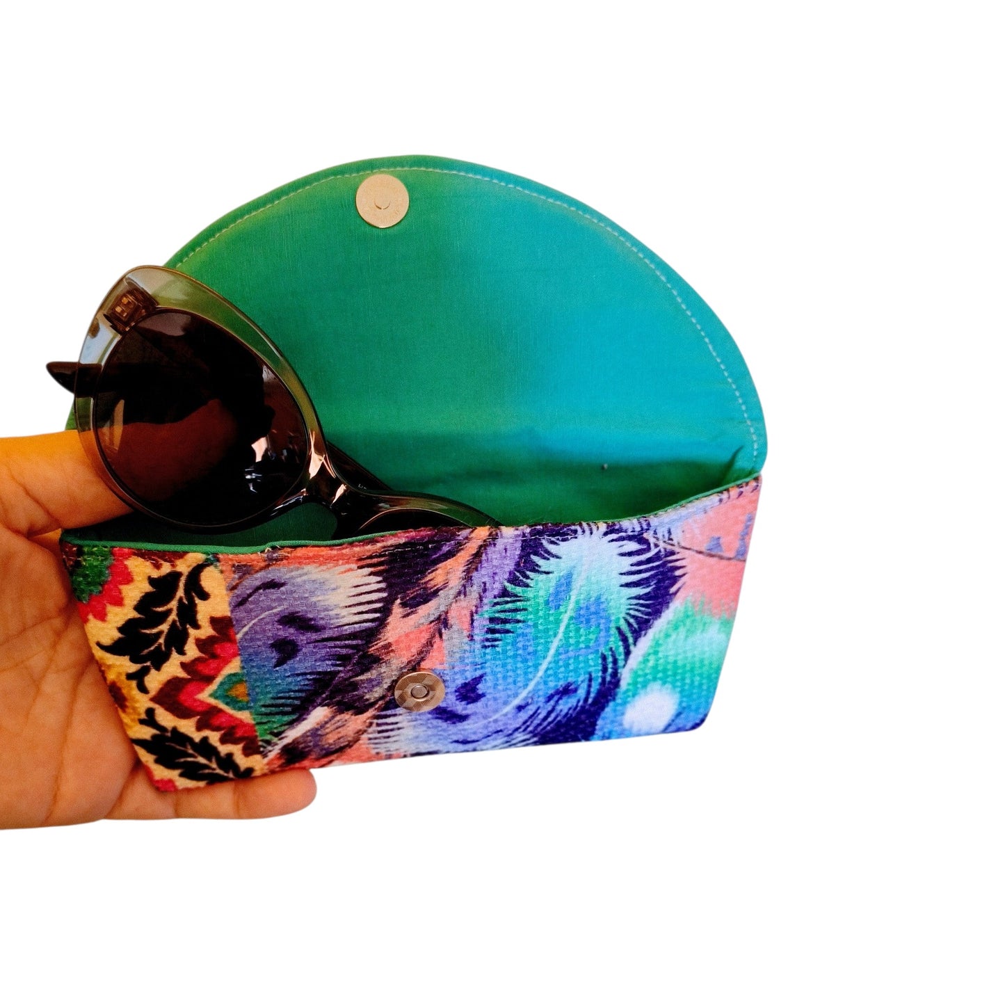 Suepatchwork handmade fabric glasses case featuring a vibrant purple feather print and a green interior lining.