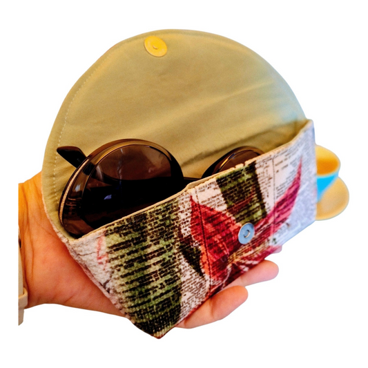 Suepatchwork handmade fabric glasses case featuring a festive Christmas flower print and a secure snap button closure.