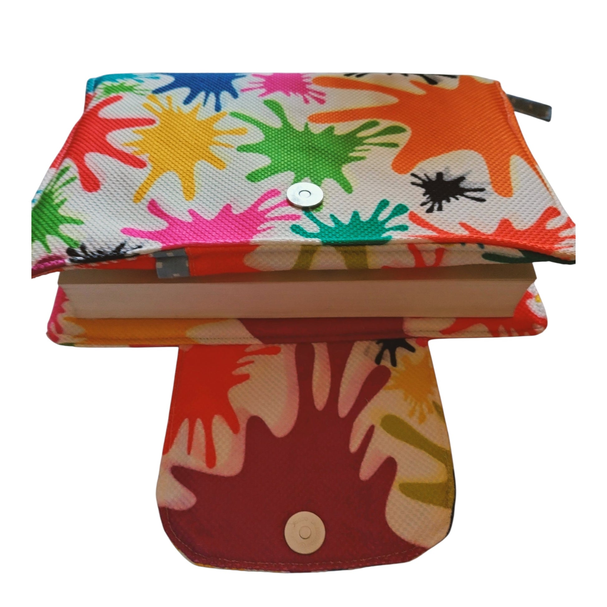 Suepatchwork handmade fabric Quran cover with a colorful paint splash pattern and magnetic snap closure