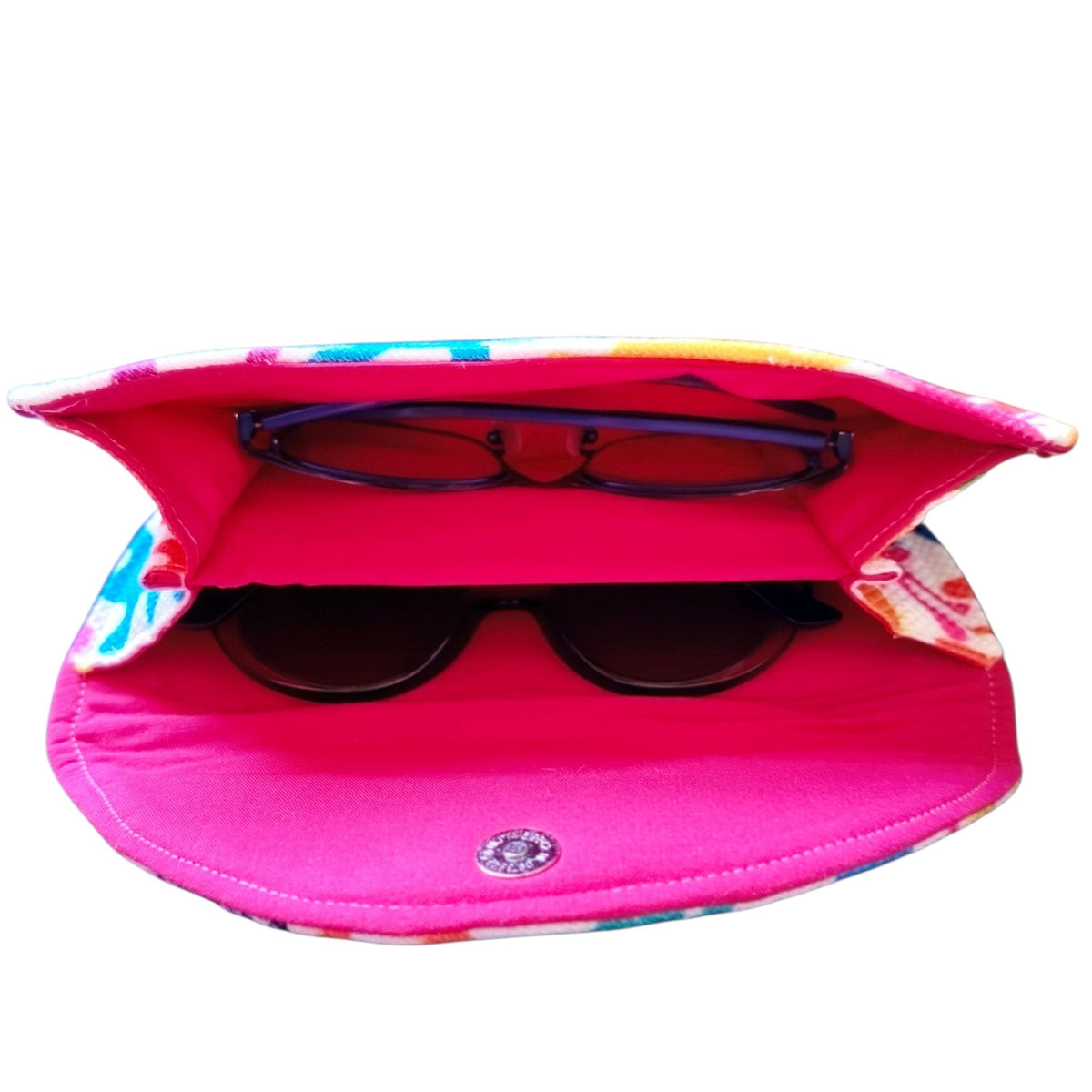 Suepatchwork handmade double glasses case in colorful fabric with a vibrant pink interior for two pairs of glasses