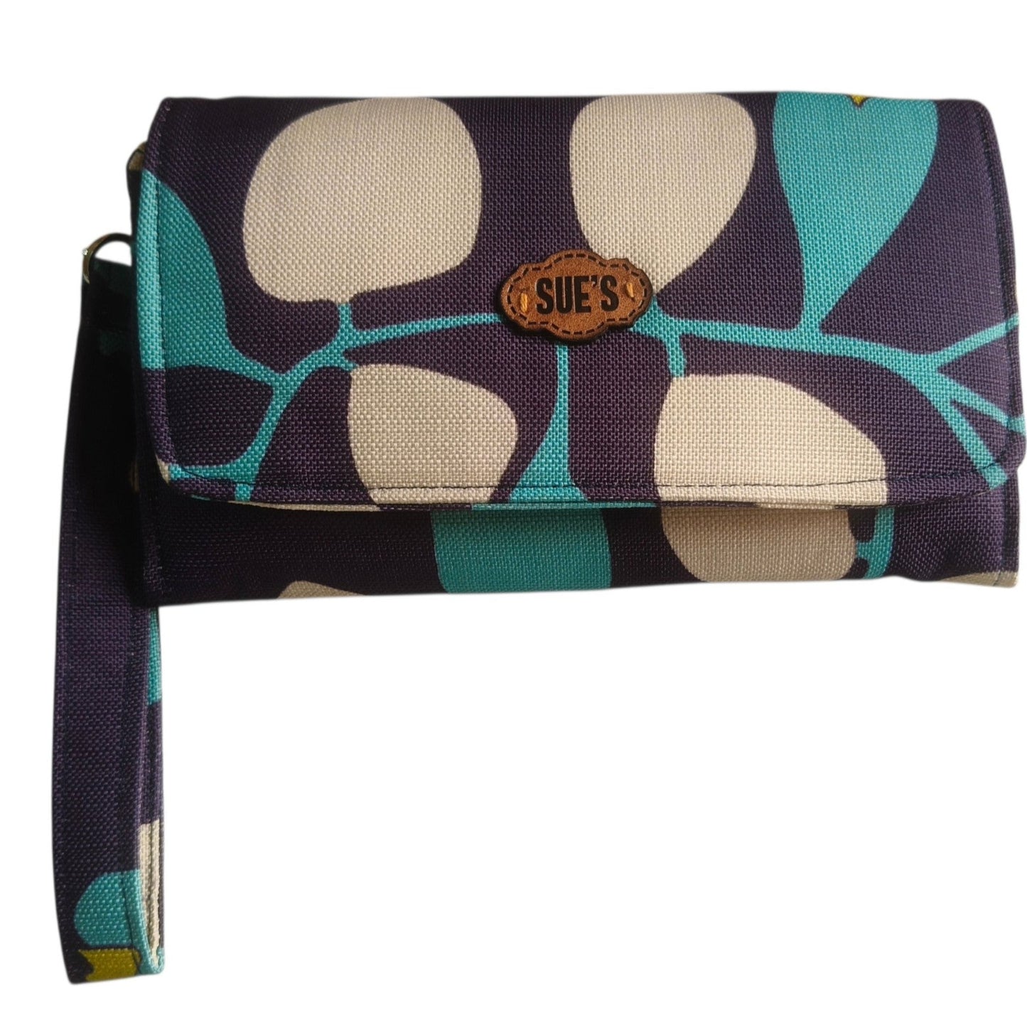 Suepatchwork Fayrous large wallet in navy blue and teal with a floral pattern, featuring a wrist strap and logo tag.