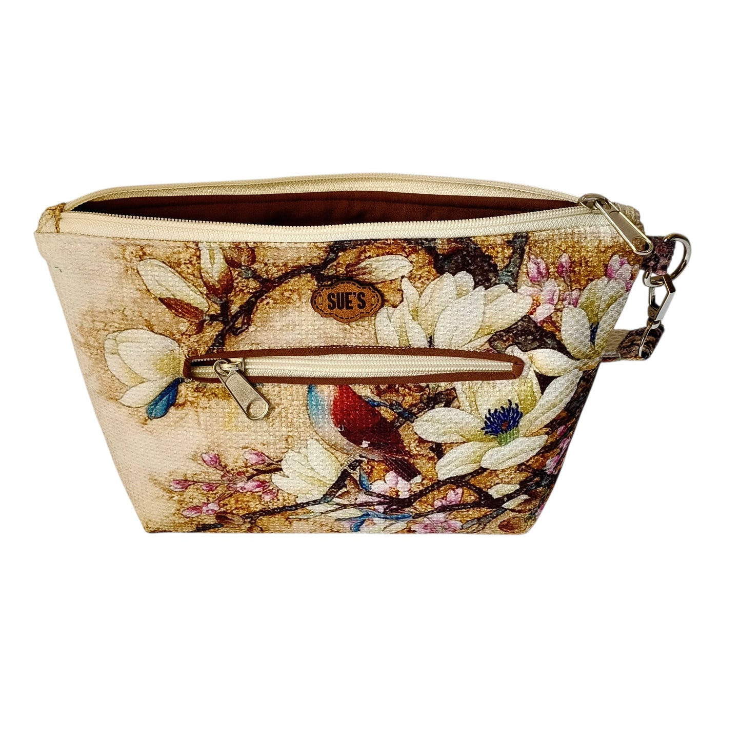 Suepatchwork handmade fabric clutch featuring a bird and floral print with an exterior zip pocket and brown lining.