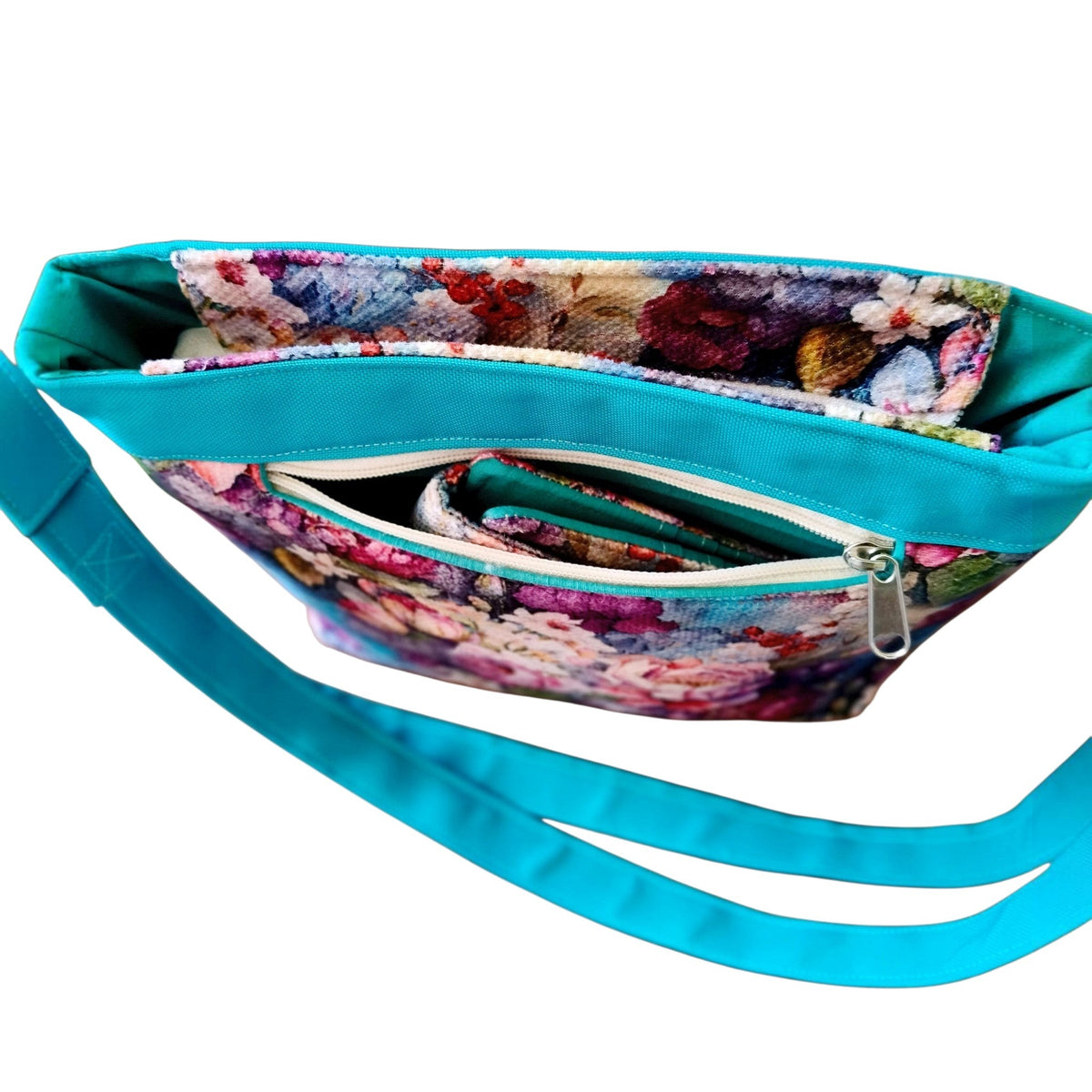 Suepatchwork floral rose garden crossbody bag with teal adjustable strap and interior zip pocket