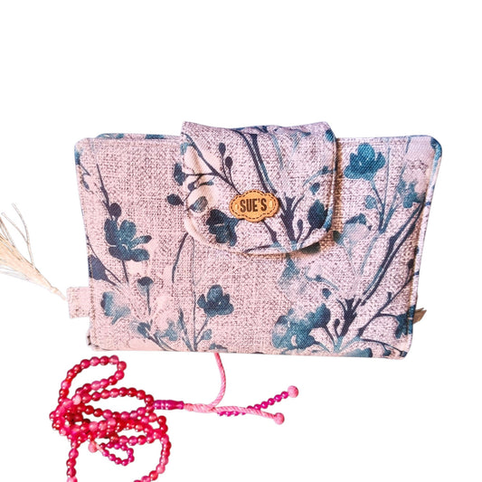 Suepatchwork handmade fabric Mus7af cover in floral print with a wooden brand tag and matching pink prayer beads