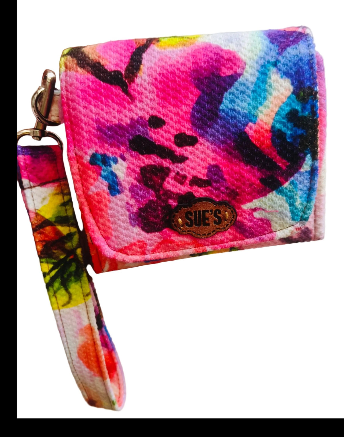 Suepatchwork fabric wristlet wallet featuring a vibrant multi-coloured abstract floral print and a detachable strap.