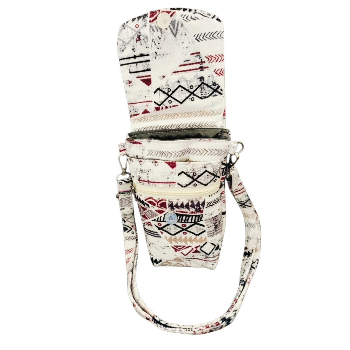 Suepatchwork white geometric print crossbody phone bag with magnetic flap closure, front zip pocket, and strap.