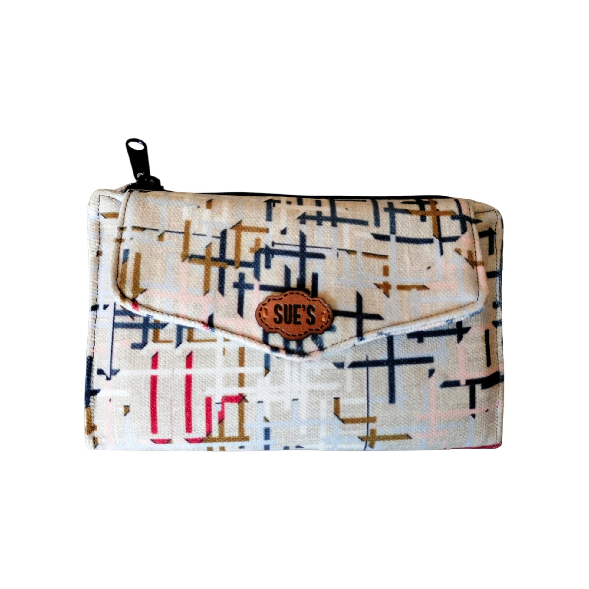 Suepatchwork trifold wallet in cream fabric with a geometric grid pattern, featuring a leather logo and zipper pocket.