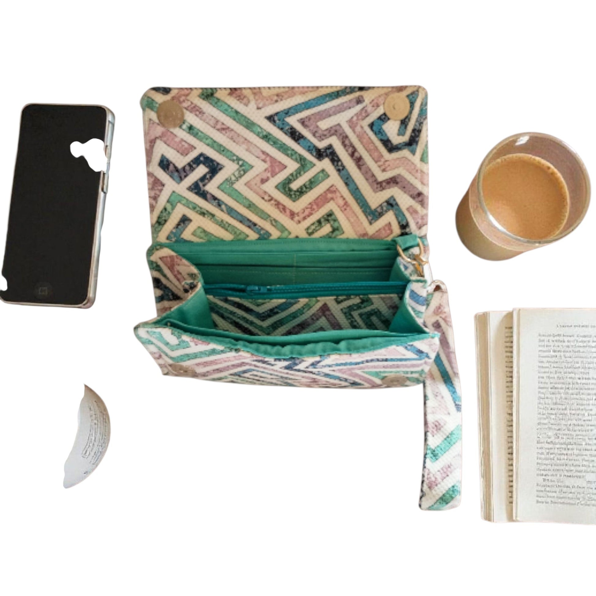Suepatchwork handcrafted fabric wallet with geometric print, teal lining, detachable strap, and internal zip pocket.
