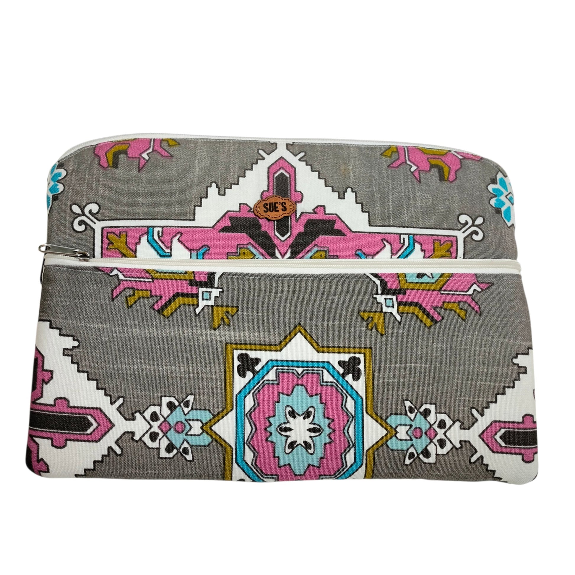Suepatchwork handmade 13-inch laptop sleeve featuring a grey fabric with a vibrant geometric pink and blue pattern.