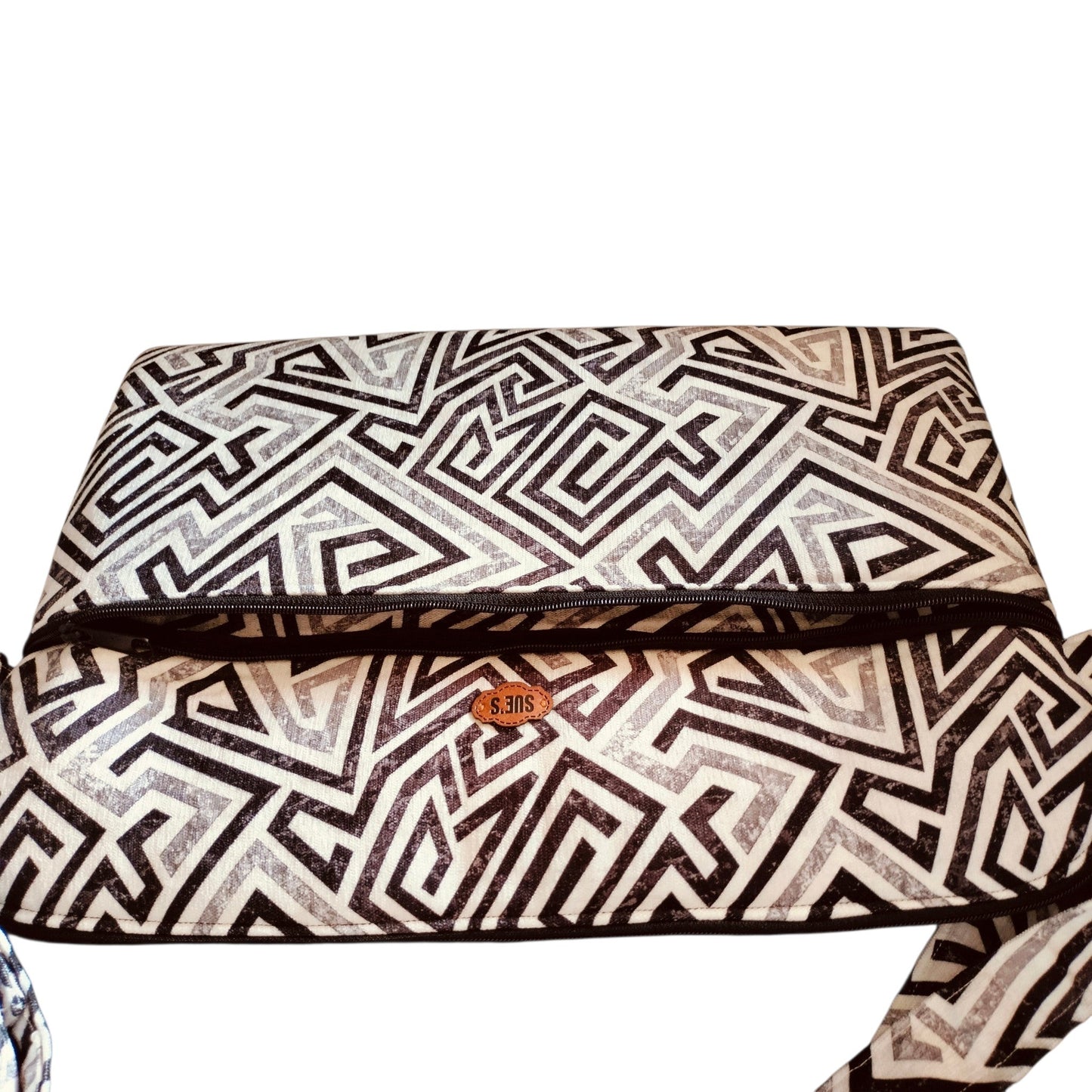 Suepatchwork handmade 15.6-inch laptop sleeve featuring a black and white geometric pattern and a secure zipper closure.