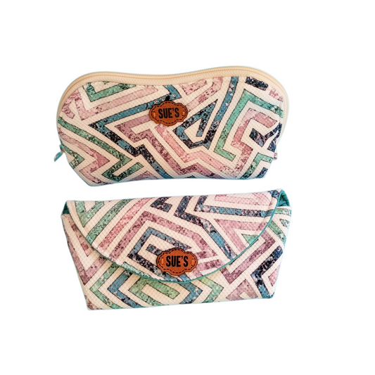 Suepatchwork handmade gift set featuring a geometric patterned makeup bag and eyeglasses case with leather logo tags.