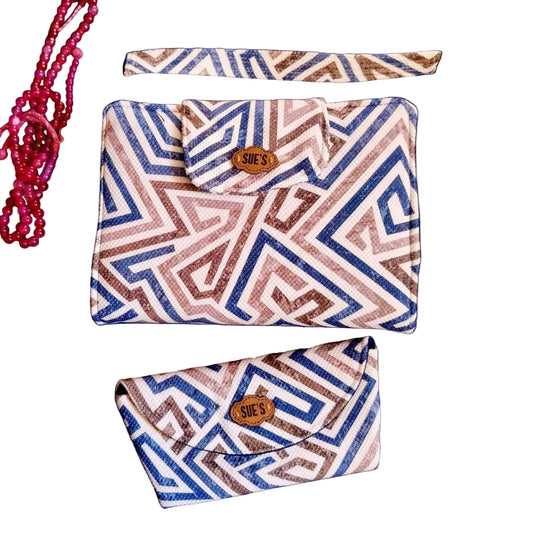 Suepatchwork summer collection bundle featuring a geometric blue and brown patterned Mushaf cover and sunglasses case.