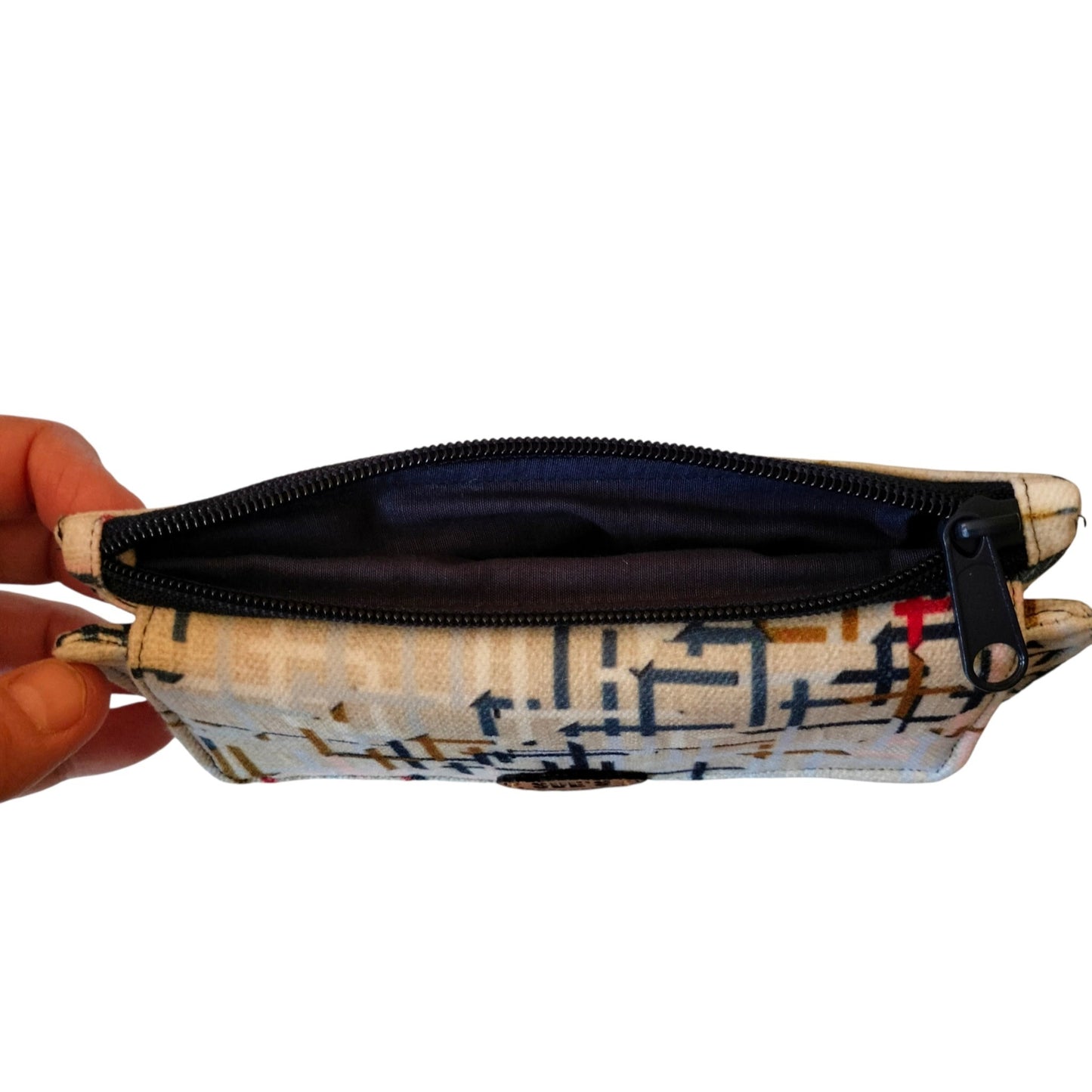 Suepatchwork handmade trifold wallet in beige fabric with geometric pattern, featuring a black zipper pocket.