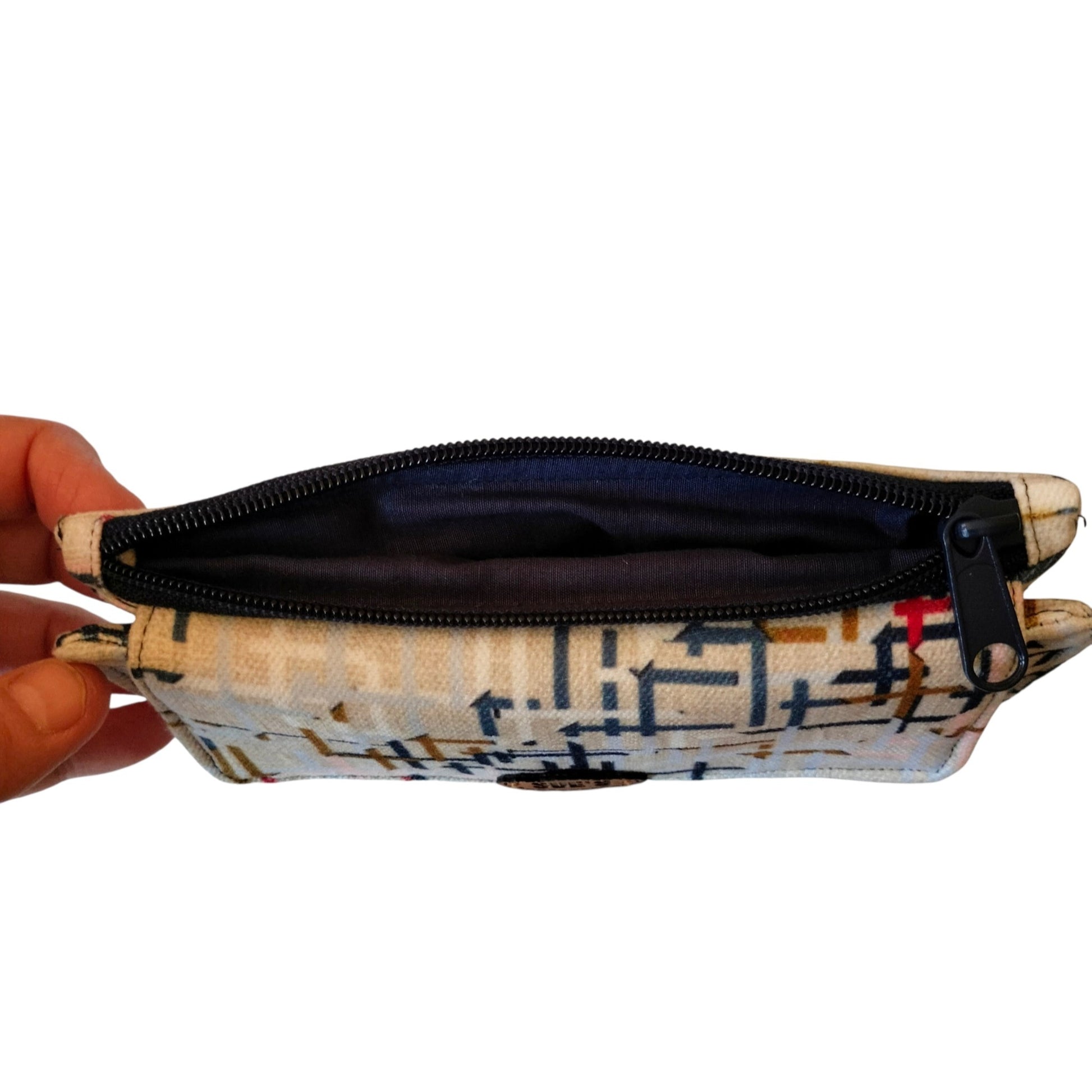 Suepatchwork handmade trifold wallet in beige fabric with geometric pattern, featuring a black zipper pocket.