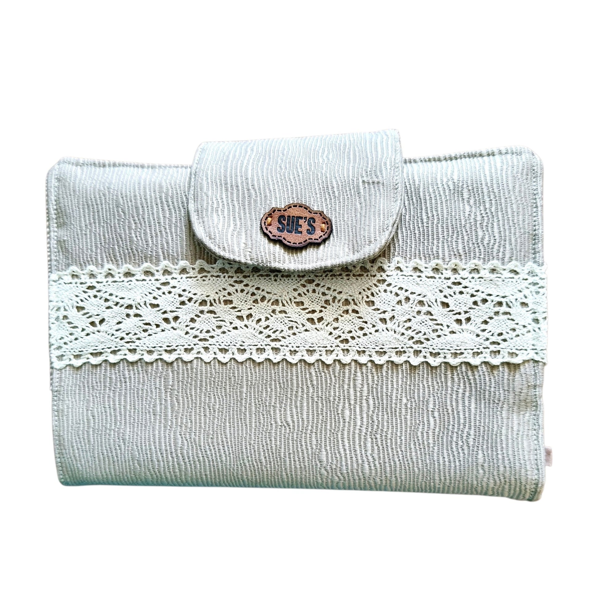 Suepatchwork gold fabric Quran cover with delicate lace trim and a branded leather tag, 20x14cm size.