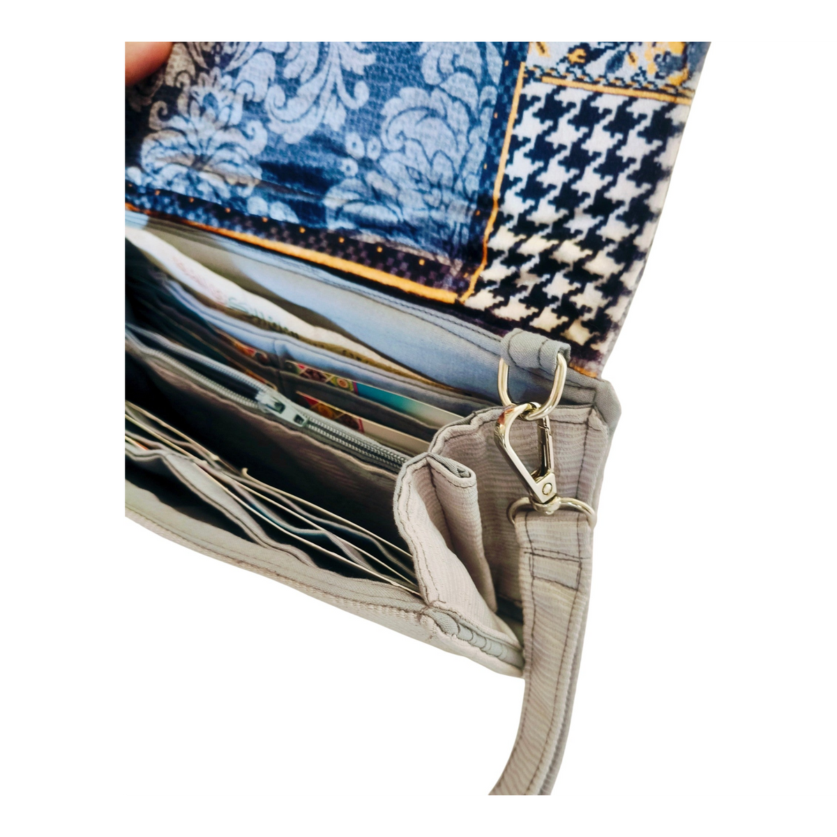 Suepatchwork gray fabric wallet with blue patterned interior and multiple card slots for organized daily use