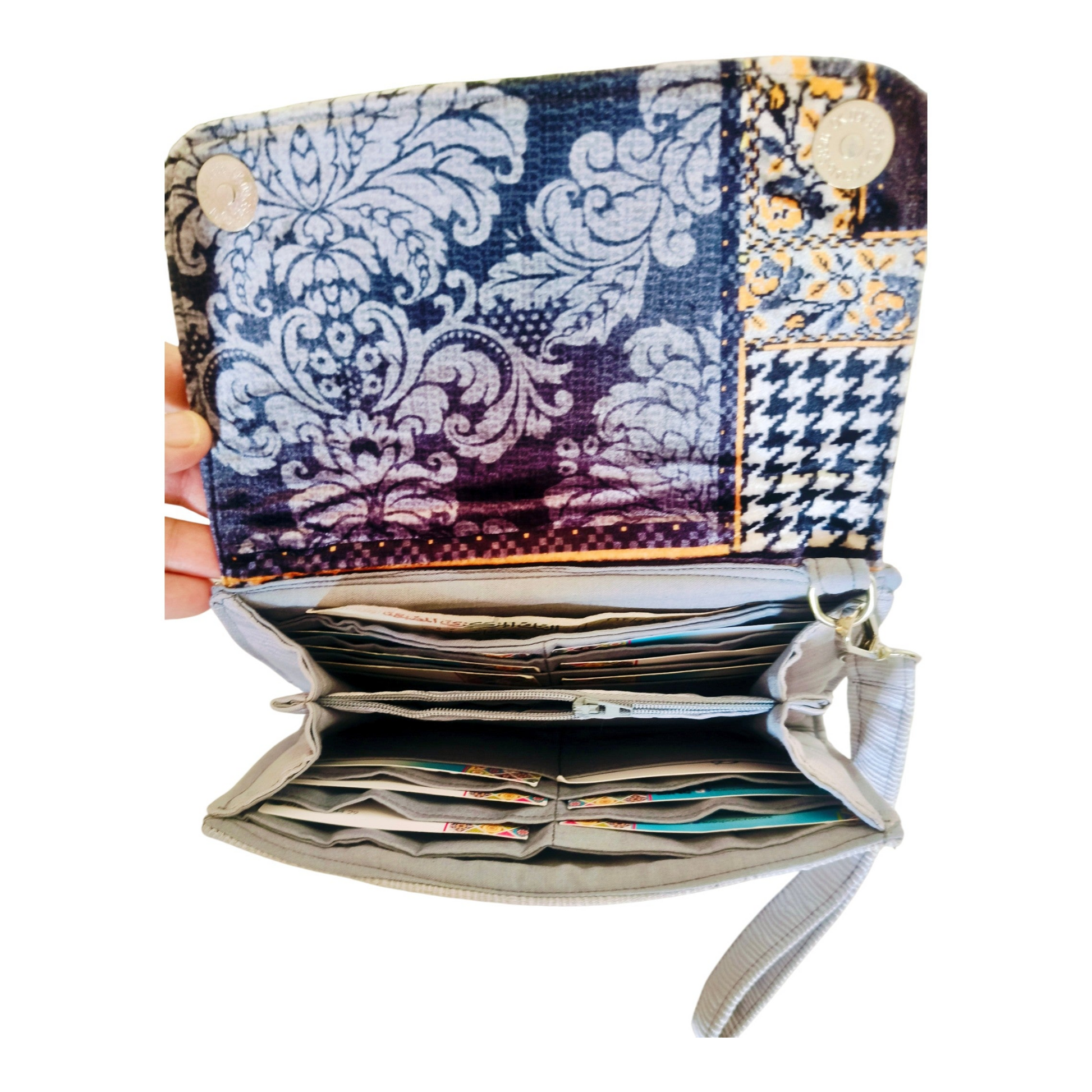 Suepatchwork gray large wallet with patterned fabric flap, featuring multiple card slots and cash compartments.