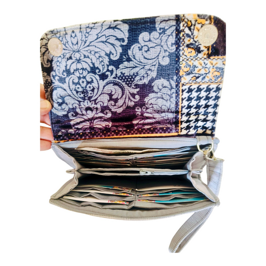 Suepatchwork gray large wallet with patterned fabric flap, featuring multiple card slots and cash compartments.