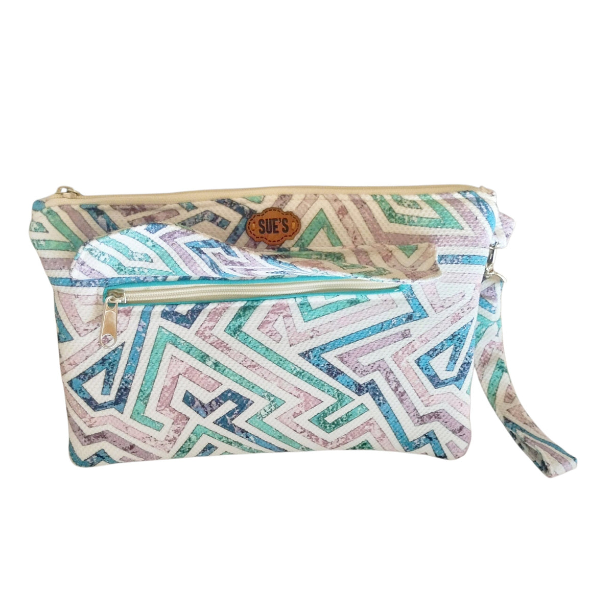 Suepatchwork handmade fabric clutch with geometric pattern in teal and purple, featuring an external zip pocket.