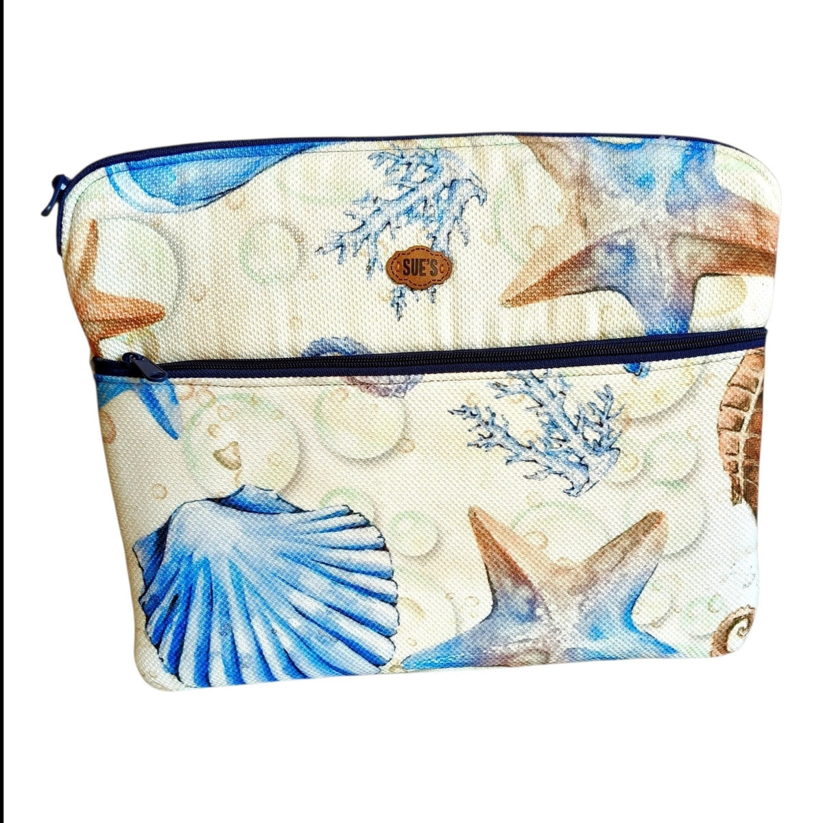 Suepatchwork handmade 15.6-inch laptop sleeve featuring a beige fabric with blue starfish and seashell print.