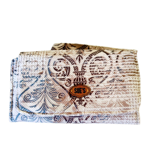 Suepatchwork large wallet with intricate beige and blue Arabic-inspired patterns and a branded leather logo patch