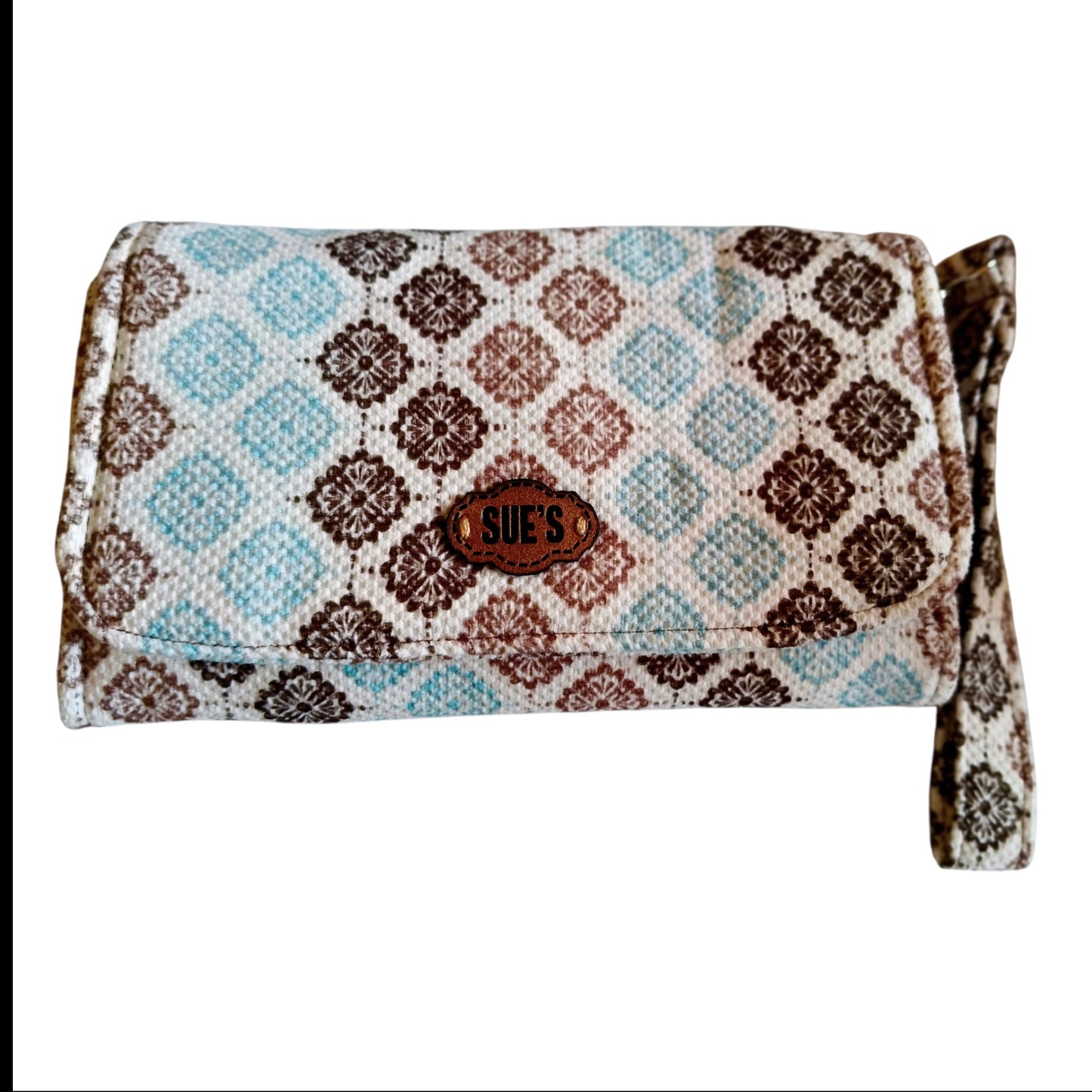 Suepatchwork large fabric wallet with blue and brown geometric floral pattern and a leather brand logo tag
