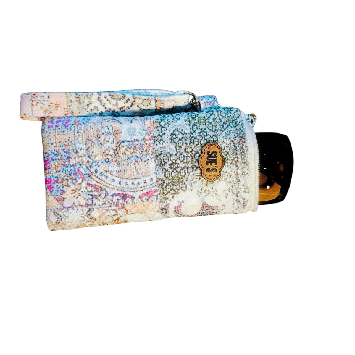 Suepatchwork handmade patchwork quilted glasses case with a wrist strap and branded leather tag