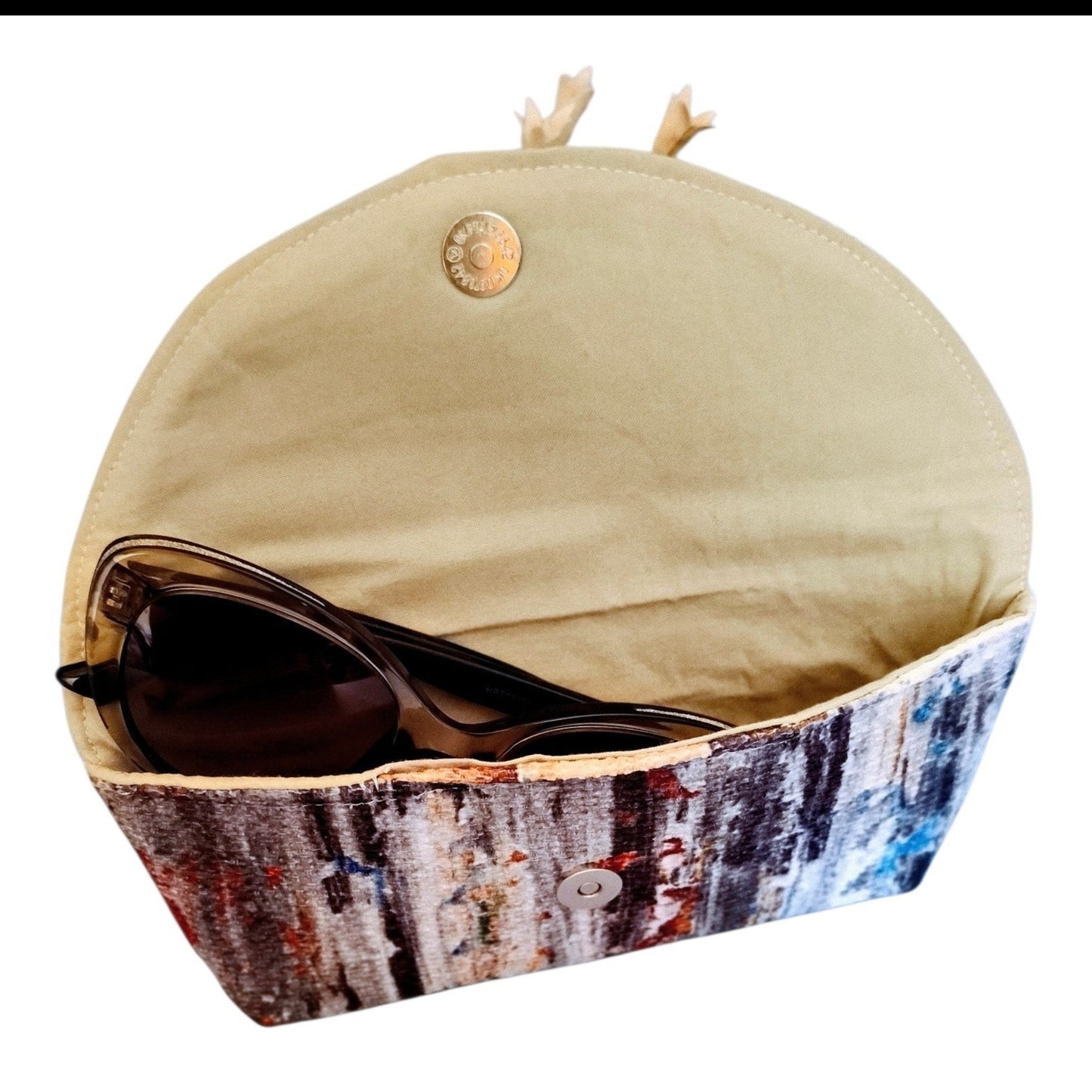 Suepatchwork handmade glasses case featuring a vibrant scrambled color fabric pattern with a magnetic snap closure.