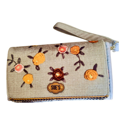Suepatchwork silver gray large wallet with floral embroidery, wrist strap, and branded leather patch.