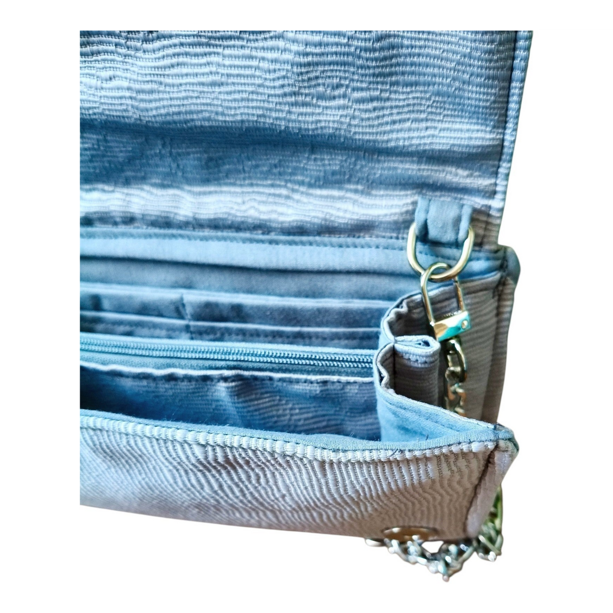 Suepatchwork silver textured evening wallet with a detachable chain strap and multiple card slots