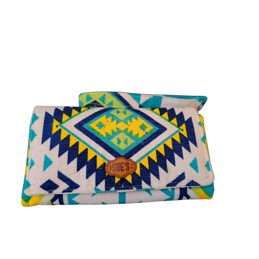 Suepatchwork Tropical Vibes large wallet with geometric patterns in blue, yellow, and white with a leather logo tag.