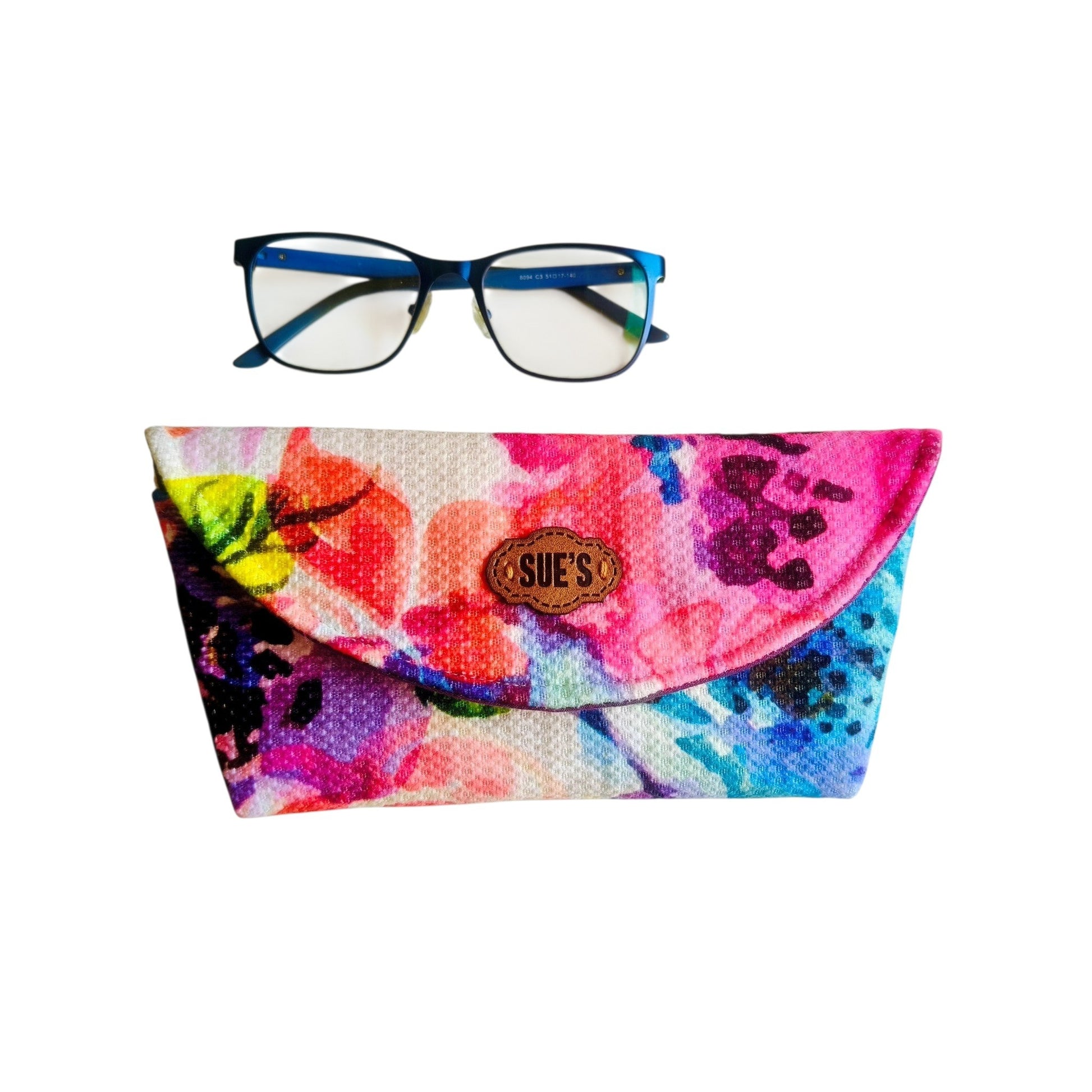 Suepatchwork handmade fabric glasses case with vibrant watercolor floral pattern and a branded leather label